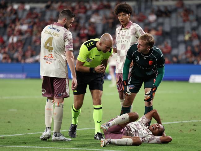 Antonee Burke-Gilroy of the Roar lays on the ground injured during the round eight A-League Men match between Western Sydney Wanderers and Brisbane Roar at CommBank Stadium. Picture: Cameron Spencer/Getty Images