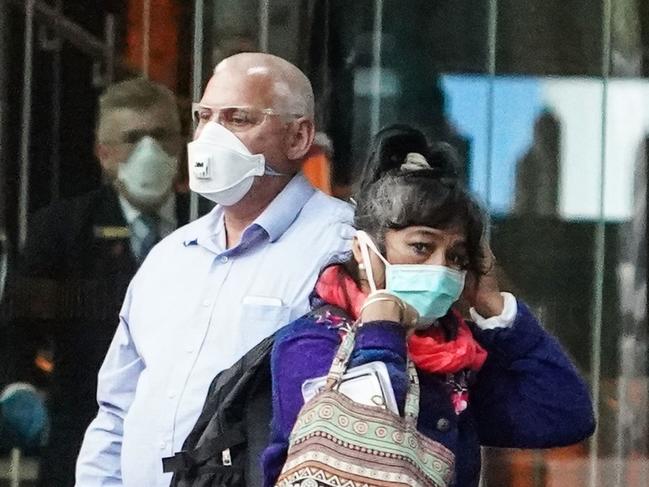 Australians are wearing masks in a bid to keep the virus away. Picture: AAP