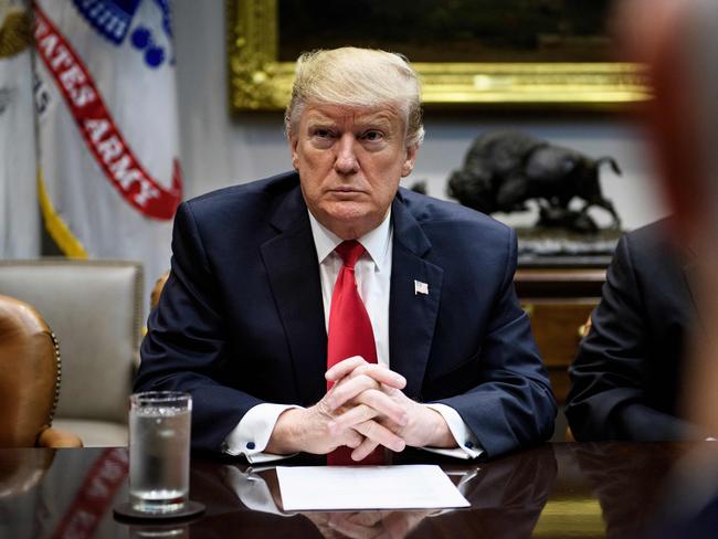 TOPSHOT - US President Donald Trump waits after a meeting with Hispanic pastors in the Roosevelt Room of the White House January 25, 2019 in Washington, DC. (Photo by Brendan Smialowski / AFP)