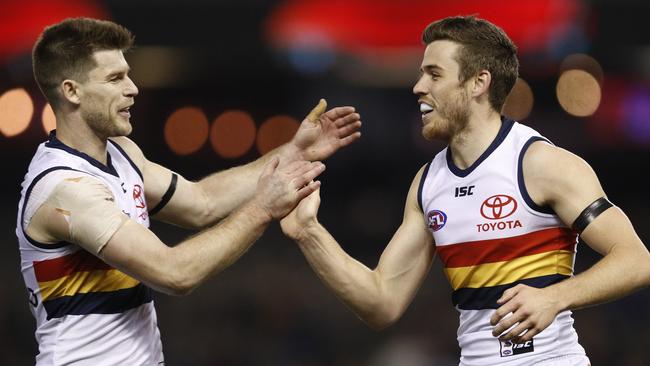 Paul Seedsman of the Crows (right) celebrates a goal with Bryce Gibbs. Picture: AAP Image/Daniel Pockett