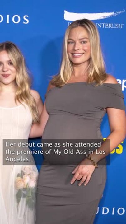 Margot Robbies shows off baby bump on red carpet in LA