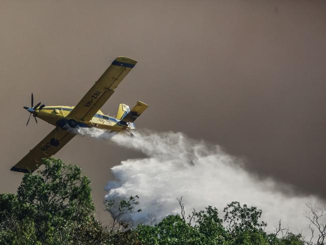 Water bombers battle Dangerous fire conditions as a fire rolls through the Litchfield/Batchelor Area Picture GLENN CAMPBELL