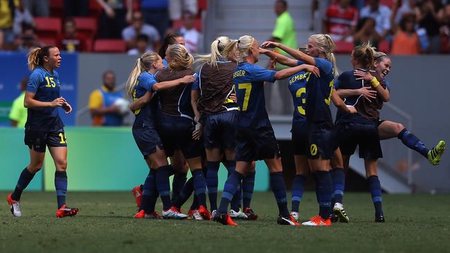 The Swedish team celebrate Stina Blackstenius’ goal.