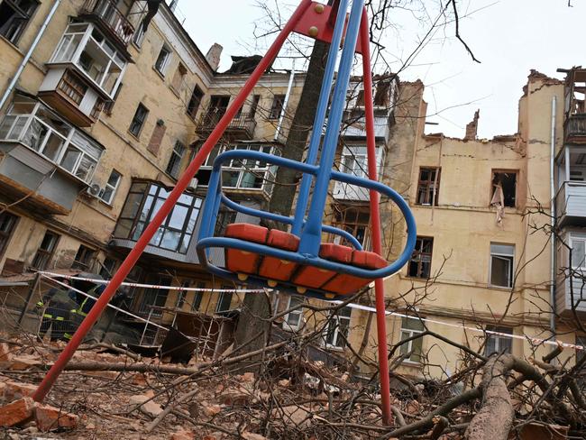 A children's swing is seen outside a residential building, partially destroyed after a missile strike in Kharkiv. Picture: AFP