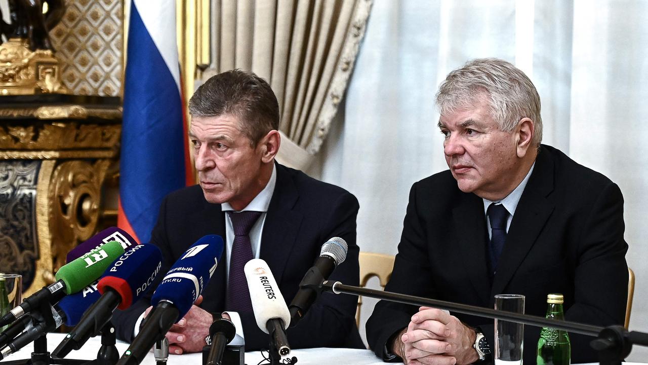 Kremlin's deputy chief of staff Dmitry Kozak (L) and Russian Ambassador to France Alexey Meshkov speak after the Paris ceasefire talks. Picture: AFP