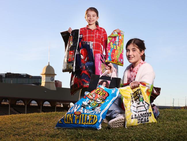 Esther McKeering, 8, Ascot, and Ruby Gibson, 11, Alderley, with EKKA showbags, Bowen Hills. Picture: Liam Kidston