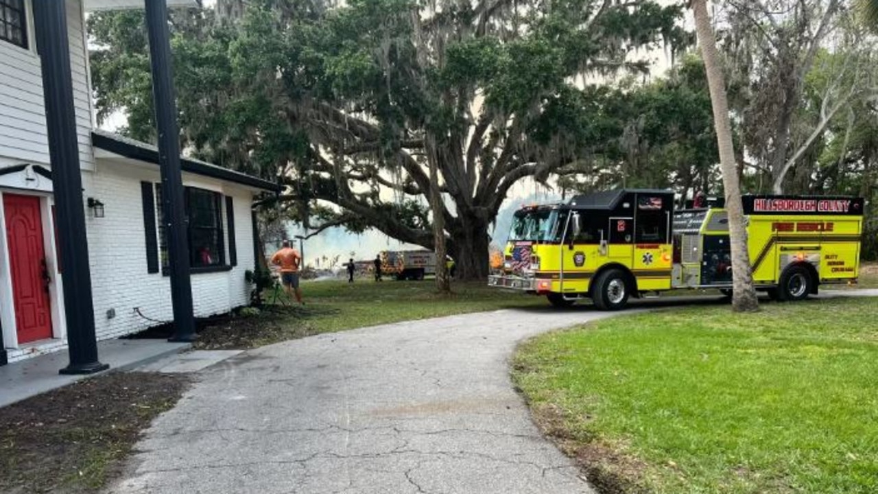 The brush behind the Cheek home caught fire in April from what officials said was sparked by a fire pit. Picture: Courtesy of Sara Blake.