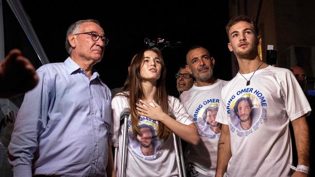 Released Israeli hostages siblings Maya and Itay Regev (R) arrive home in the city of Herzliya near Tel Aviv. Picture: AFP.