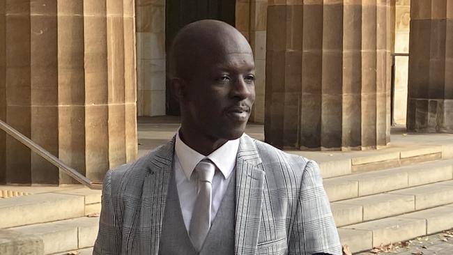 Former police officer Martin Duku outside the Adelaide Magistrates Court. Picture: Mitch Mott