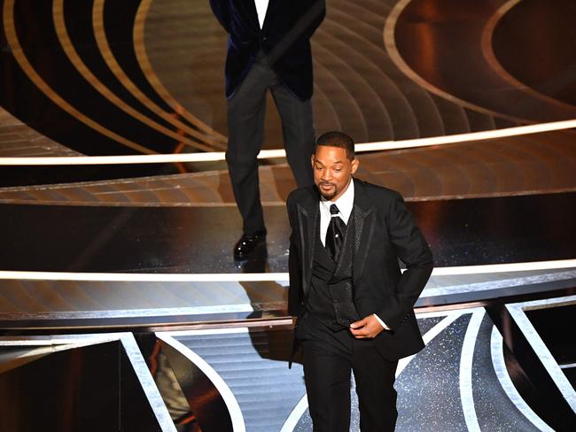 Will Smith walks away after slapping US actor Chris Rock onstage. Picture: AFP