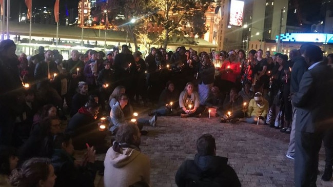 Mourners have gathered in the CBD in an emotional candlelit vigil for murdered woman Natalina Angok, whose body was found at Chinatown in the early hours of Wednesday morning.