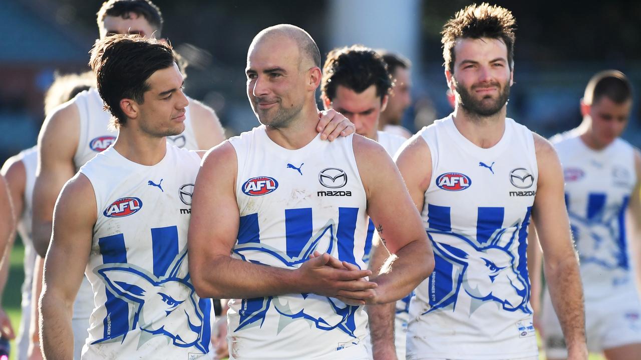 Jy Simpkin and Ben Cunnington lead the Kangaroos off Adelaide Oval. Picture: Mark Brake/Getty Images