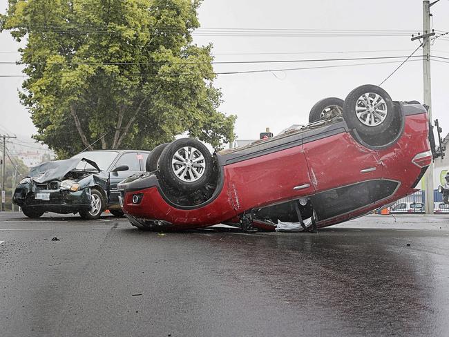 Two of the three vehicles involved in a crash on the corner of Davey and Antill streets. Picture: MATHEW FARRELL