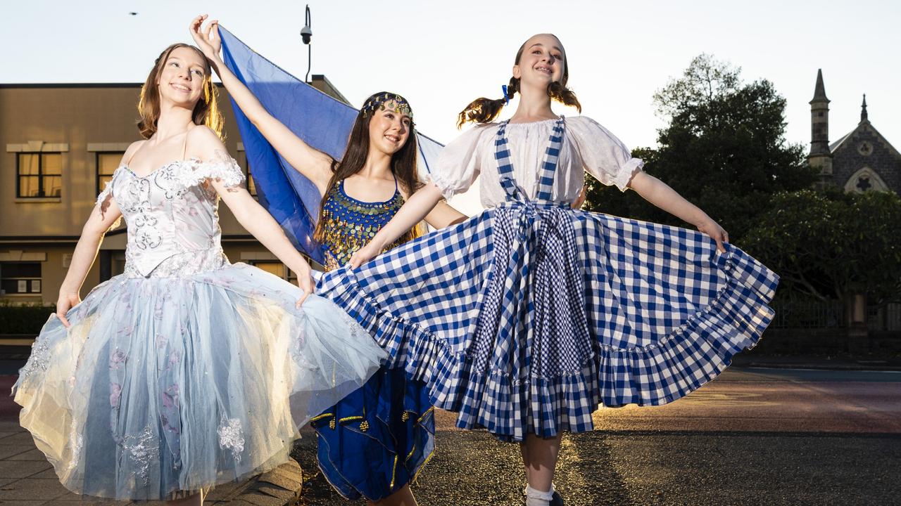 Character participants (from left) Ezri Strong, Allyssia Colosimo and Madeleine Tooley of Dance Central outside the Curious Arts Festival to attract visitors to the Empire Theatres, Saturday, April 2, 2022. Picture: Kevin Farmer