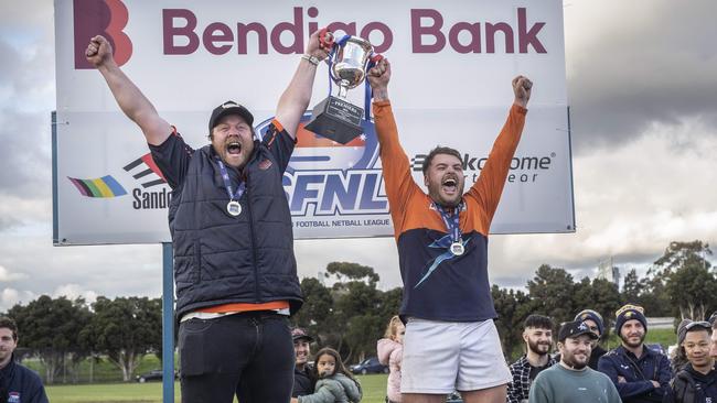 SFL: Lyndhurst coach and captain lift the premiership cup. Picture: Valeriu Campan