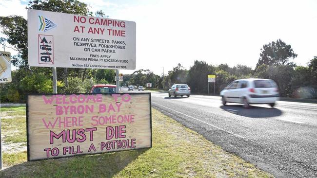 Signs placed at the southern and northern entrances to Byron Bay making it clear potholes should be fixed. Picture: Samantha Elley