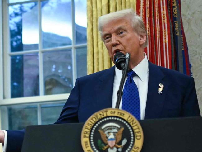 US President Donald Trump speaks after Tulsi Gabbard was sworn in as Director of National Intelligence (DNI) in the Oval Office of the White House in Washington, DC, on February 11, 2025. The Republican-controlled US Senate confirmed Tulsi Gabbard earlier as Trump's choice to lead the country's intelligence services, despite criticism over her lack of experience and past support for Russia and Syria. Gabbard -- appointed to be director of national intelligence -- has faced questions over her 2017 meeting with now-deposed Syrian leader Bashar al-Assad and her peddling of Kremlin propaganda, particularly false conspiracy theories about the Ukraine war. She is also regarded with suspicion over her views on US government surveillance and her backing for National Security Agency (NSA) leaker Edward Snowden, seen on both sides of Congress as having imperiled Americans' safety. (Photo by ANDREW CABALLERO-REYNOLDS / AFP)