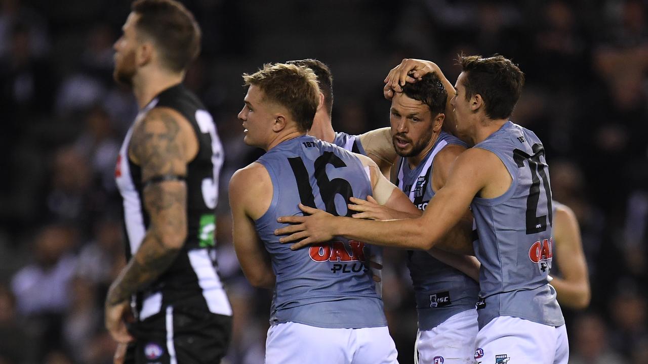 Travis Boak of the Power (second from right) reacts after kicking a goal during the Round 7 match against Collingwood. Picture: AAP Image/Julian Smith