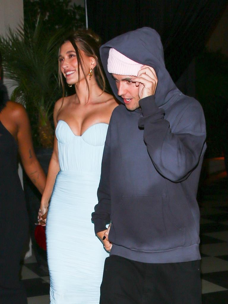 Hailey rocking a skin tight dress, while Justin looks ready to rob a bank. Picture: Backgrid