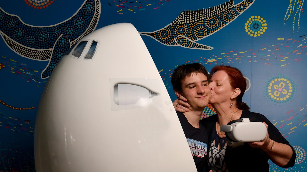 Ronald McDonald House resident Ethan Watson, 14, with his mum Julie Watson, and the new immersive VR Therapy Pod at Ronald McDonalds House Charities North Australia in Douglas. Picture: Evan Morgan