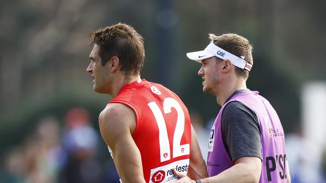 Sydney’s Josh Kennedy limps from Arden Street Oval on Sunday after injuring his left hamstring. Picture: Getty Images