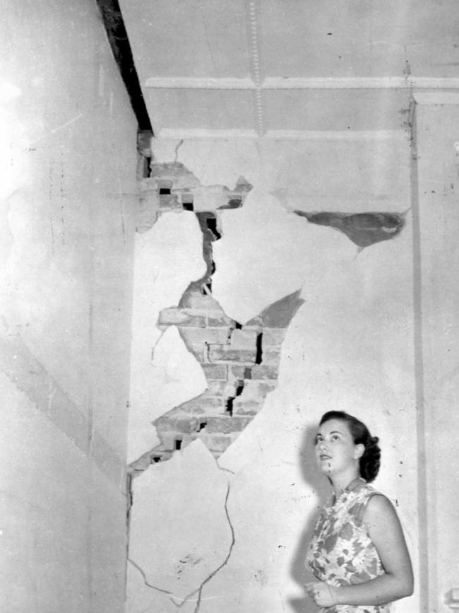 An Adelaide woman inspects damage to her home caused by the earthquake.