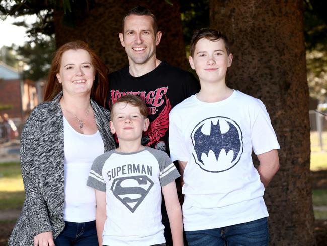 Rachael and Kevin Ben pay their sons Rory and Noah with digital pocket money. Picture: Damian Shaw