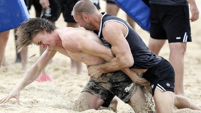 STRONGHOLD: Scott Thompson tackles Port Adelaide youngster Miles Bergman during the club’s pre-season training camp in Maroochydore. Picture: Sarah Reed.