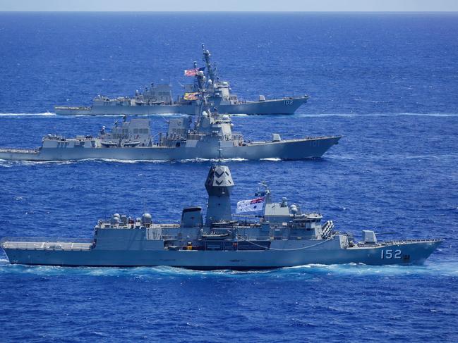 PACIFIC OCEAN (June 23, 2022) Royal Australian Navy (RAN) ship HMAS Warramunga (FFGHM 152), USS Gridley (DDG 101) and USS Sampson (DDG 102) sail in formation with Abraham Lincoln Carrier Strike Group (ABECSG), Japan Maritime Self-Defense Force and RAN ships. ABECSG is underway conducting routine operations in the U.S. 3rd Fleet. (U.S. Navy photo by Mass Communication Specialist Seaman Aleksandr Freutel) *** Local Caption *** Five Royal Australian Navy ships across two task groups are currently conducting regional presence deployments throughout the Indo-Pacific region. During their deployments the ships and their embarked ADF units will undertake joint exercises and other engagements with Australiaâs regional partners.   Regional Presence Deployments demonstrate Australiaâs commitment to promoting an open, inclusive and resilient Indo-Pacific. These deployments play a vital role in Australiaâs long term security and prosperity by protecting Australiaâs interests, preserving a rules-based order, enhancing cooperation and relationships with regional partners and allies and developing capability and interoperability.   During their deployment HMA Ships Canberra, Supply and Warramunga joined five ships from the United States Navy Abraham Lincoln Strike Group and two ships from the Japan Maritime Self-Defense Force for the sail to Pearl Harbor for Exercise Rim of the Pacific 2022 (RIMPAC).   RIMPAC will see approximately 1,600 ADF personnel participate. This year the ADF contribution is substantial including HMA Ships Canberra, Supply and Warramunga, RAAF P-8A Poseidon aircraft, a submarine, mine warfare and clearance diving capabilities, and a Joint Landing Force led by the 2nd Battalion, Royal Australian Regiment accompanied by personnel and capabilities from across Australian Army units.