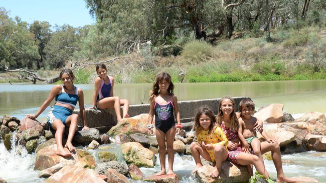 Environmental water’s arrival has meant the Whyman children - Amelia, Imogen, Olivia, Deborah, Kathalka and Kaakuru - can go swimming again. Picture: Emily Ferguson