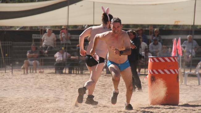 Competitors in the mens budgie smugglers race at the Henley on Todd in Alice Springs, Saturday, August 17, 2024. Picture: Gera Kazakov