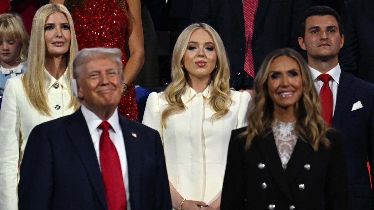 Trump (L) stands with co-chair of the Republican National Committee Lara Trump (R), (from top L) daughter Ivanka Trump, daughter Tiffany Trump and her husband Michael Boulos. Picture: Jim watson/AFP