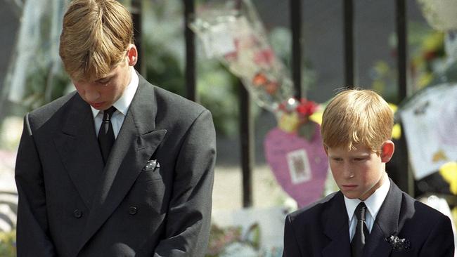 Prince William (left) and Prince Harry bow their heads as the coffin of their mother, Princess Diana, is taken out of Westminster Abbey following her funeral service Picture: Getty Images