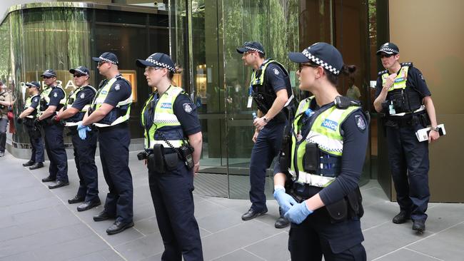 Police wait for protesters in front of the Rio Tinto offices. Picture: AAP