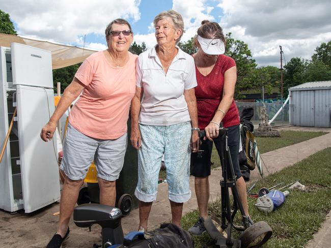 Cathy Judd and Maryanne Devery help out at Arthur and Wendy Hogan’s Bowen St property in Brisbane’s Windsor. Picture: Brad Fleet