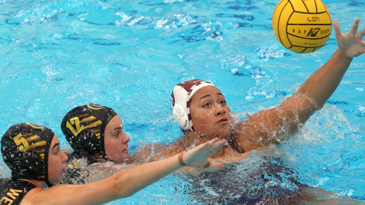 <p>Taafili Taoso of Queensland Maroons under pressure from Caitlin Leather (centre) and Isabella Sayer of Western Australia.</p>