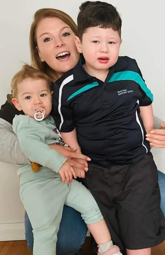 Devonport boy Dallas Brown, 4, who possessed the nearly unheard of TANC2 genetic mutation, with his mum Courtney and sister Haisley. Picture: Supplied