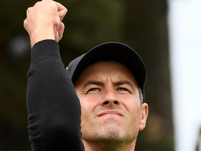 MELBOURNE, AUSTRALIA - DECEMBER 15:  Adam Scott of Australia and the International team reacts after holing out on the 15th hole during Sunday Singles matches on day four of the 2019 Presidents Cup at Royal Melbourne Golf Course on December 15, 2019 in Melbourne, Australia. (Photo by Quinn Rooney/Getty Images)