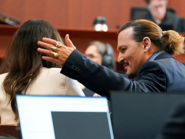 Actor Johnny Depp talks with his attorney Camille Vasquez after she spoke during closing arguments at the Fairfax County Circuit Courthouse in Fairfax, Virginia. Picture: AFP