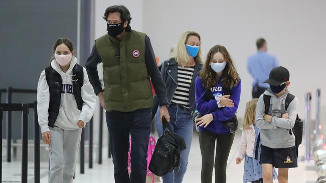 AFL CEO Gillon McLachlan and his family leave on the last flight. Picture: Alex Coppel