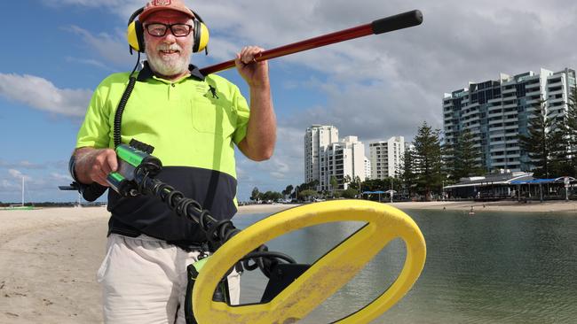 Mick Egan is a Gold Coast metal detector who helps reunite people with their sentimental items and valuables. Mick working at Harley Park Labrador. Picture Glenn Hampson