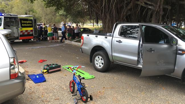 CareFlight and ambulance crews treat the boy at the Spit Reserve carpark.