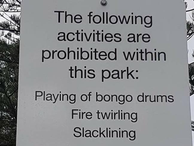 Burleigh locals are outraged after a sign banning bongo drums and fire twirlers popped up in the park. Photo: Facebook