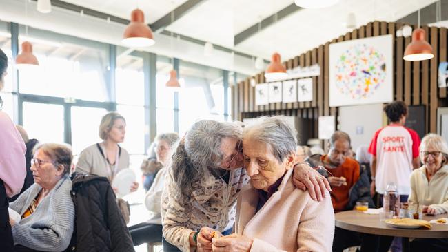 A volunteer with one of the residents. Picture: The Telegraph