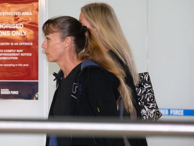 Yvette Nikolic bolts after she sees media when she enters the arrivals hall at Tullamarine Airport. Picture: Sarah Matray