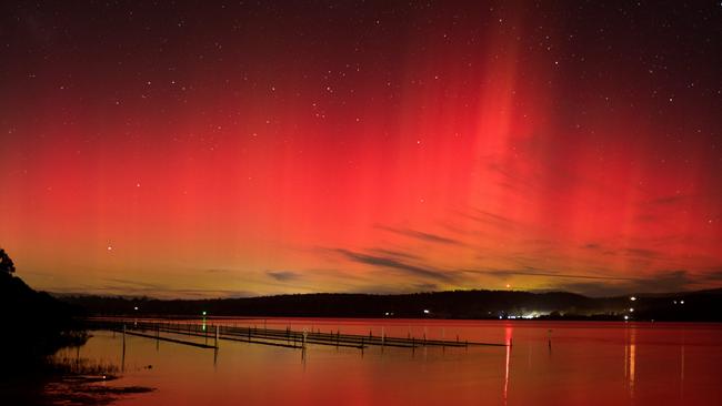 Aurora Australis seen from Merimbula Lake, NSW, late on Sunday night. Picture: Fiona Brook