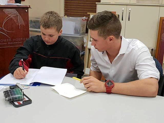 Speak up for Sport graduate Cameron Shields (right) helps young athlete Aiden Bell with his speech during a recent course. Picture: Contributed