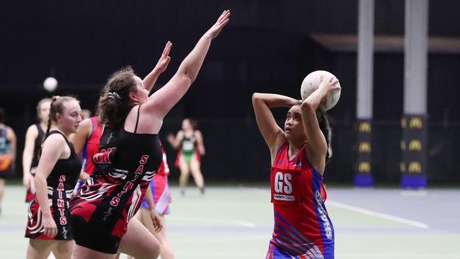 Sharks' Allessandra Smith-Ani shoots the ball in the Cairns Netball Association Senior Division 1 match between Cairns Saints and Sharks. PICTURE: BRENDAN RADKE