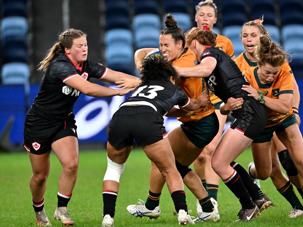 Australia's Maya Stewart is tackled by Canada's Fancy Bermudez during the 33-14 loss at Allianz Stadium. Picture: AFP