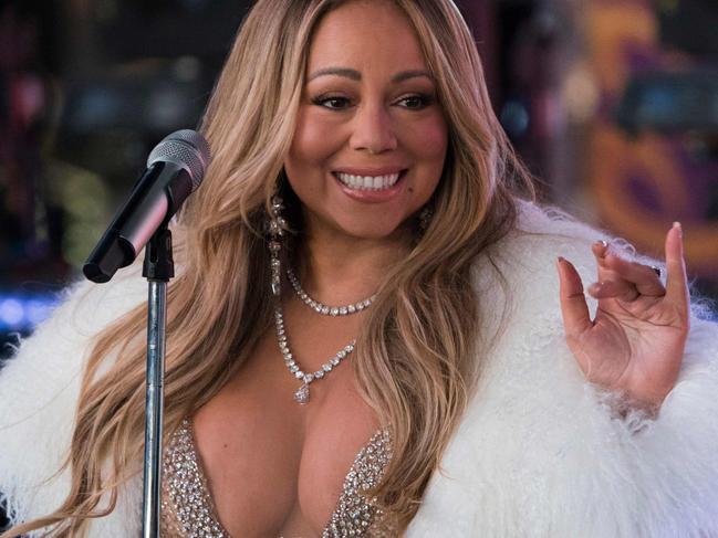 American singer, songwriter, Mariah Carey performs during New Year's Eve celebrations in Times Square on January 1, 2018 in New York. / AFP PHOTO / DON EMMERT